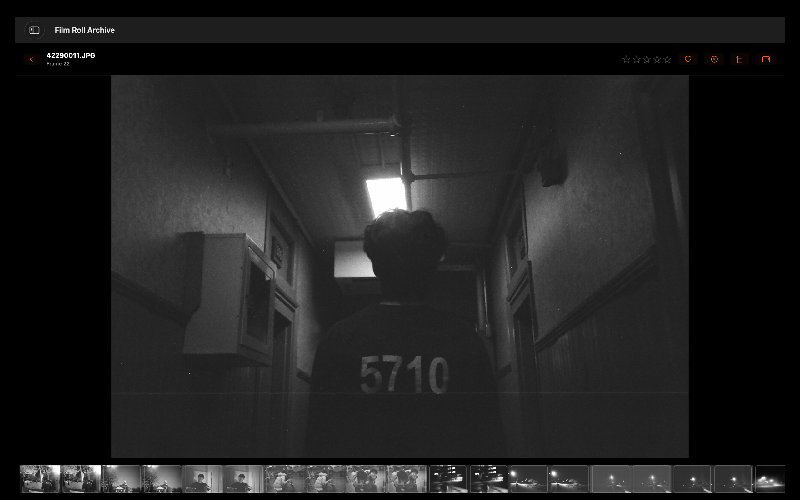 A black-and-white film frame open in Frame Film Roll Archive